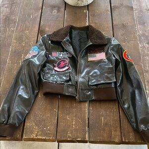 TOP GUN Brown Bomber Jacket with Patches “Maverick” name patch above flag patch